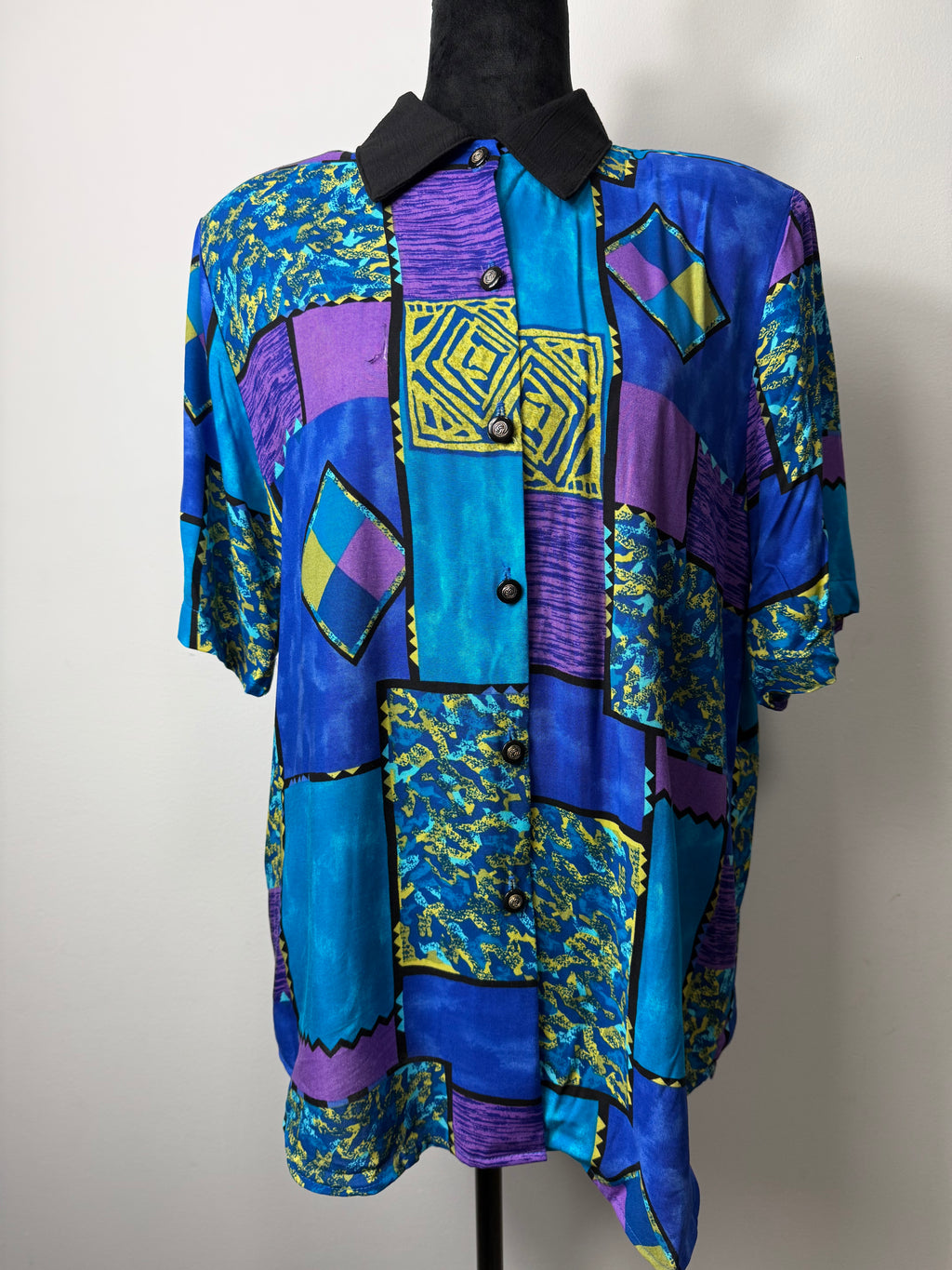 From the black mixed print vintage top