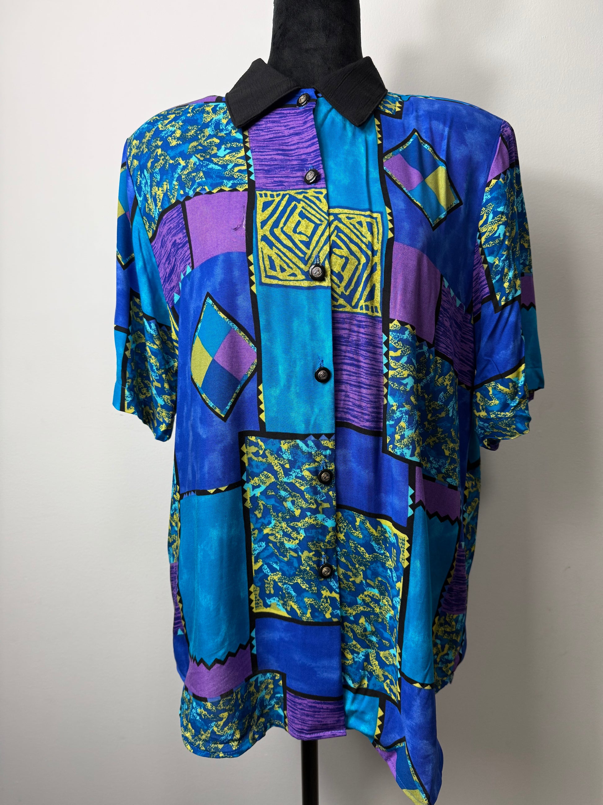 From the black mixed print vintage top