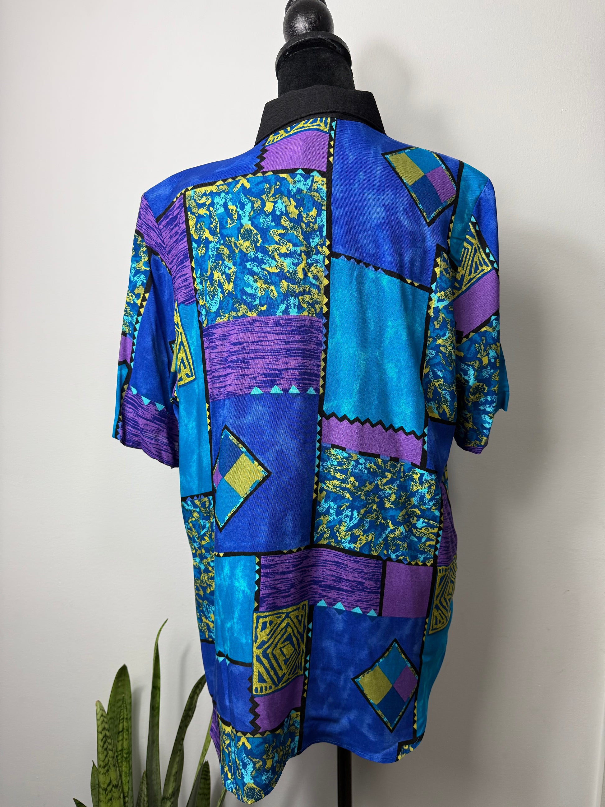 From the black mixed print vintage top